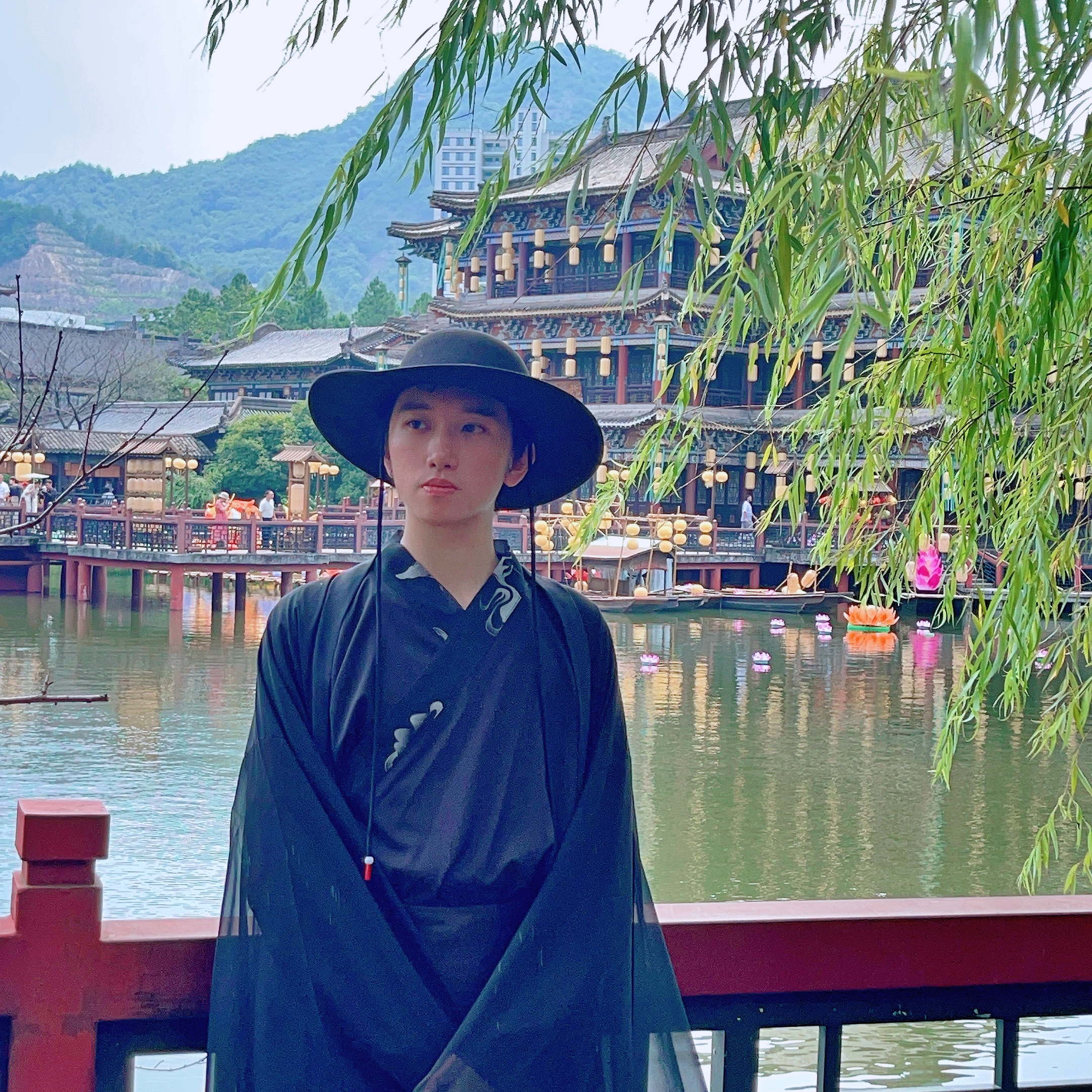 boy in black costume and dynasty background